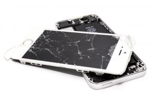 Image of 2 smartphones with broken screens.